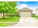 Charming single-story home with brick facade, mature landscaping, and an attached two-car garage at 1630 Eastfork Dr, Brownsburg, IN 46112