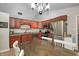 Well-lit kitchen featuring cherry cabinets, stainless steel appliances, and tile flooring at 1630 Eastfork Dr, Brownsburg, IN 46112