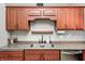 Kitchen area highlighting cherry cabinets, and modern stainless steel appliances at 1630 Eastfork Dr, Brownsburg, IN 46112
