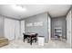 Bright living room with neutral walls and plush carpet plus game table in the background at 1630 Eastfork Dr, Brownsburg, IN 46112