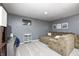 Cozy finished basement with neutral walls, plush carpet, recessed lights, and sectional couch at 1630 Eastfork Dr, Brownsburg, IN 46112