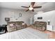 Spacious living room with wood floors, ceiling fan and comfortable seating at 1630 Eastfork Dr, Brownsburg, IN 46112