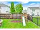 Backyard play area with a swing set and slide, perfect for outdoor fun at 1630 Eastfork Dr, Brownsburg, IN 46112