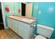 Bright bathroom featuring a double sink vanity, tile floors, and modern fixtures at 1635 N College Ave # 4, Indianapolis, IN 46202