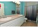 Inviting bathroom with a double sink vanity, tile floors, and shower-tub combo at 1635 N College Ave # 4, Indianapolis, IN 46202