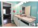Bathroom featuring a double sink vanity with ample storage space at 1635 N College Ave # 4, Indianapolis, IN 46202