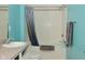 Bright bathroom featuring a tiled bathtub with shower and a gray shower curtain at 1635 N College Ave # 4, Indianapolis, IN 46202