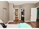 Bedroom with multiple doorways, closet, and bathroom at 1635 N College Ave # 4, Indianapolis, IN 46202