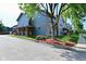 Attractive townhouse with a landscaped yard and inviting front porch at 1635 N College Ave # 4, Indianapolis, IN 46202
