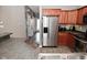 Modern kitchen featuring stainless steel appliances, updated cabinets, and stone countertops at 1635 N College Ave # 4, Indianapolis, IN 46202