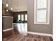 Open-concept living area featuring vinyl flooring and lots of natural light at 1635 N College Ave # 4, Indianapolis, IN 46202