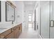 Bright bathroom featuring double vanity, walk-in shower, and modern design at 1663 Fernley Dr, Westfield, IN 46074