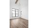 Bright bedroom with wood floors, a modern chandelier, and a large window at 1663 Fernley Dr, Westfield, IN 46074
