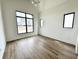 Bedroom with large windows providing lots of natural light and hardwood flooring at 1663 Fernley Dr, Westfield, IN 46074