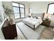 Bright bedroom features a large window and neutral decor for a serene retreat at 1663 Fernley Dr, Westfield, IN 46074