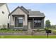 Charming home featuring a mixed material facade, inviting entrance, and professionally landscaped yard at 1663 Fernley Dr, Westfield, IN 46074