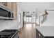 Modern kitchen flowing into the dining room featuring stainless appliances and open floor plan at 1663 Fernley Dr, Westfield, IN 46074