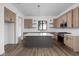 Modern kitchen featuring an island, stainless steel appliances, and custom cabinets at 1663 Fernley Dr, Westfield, IN 46074