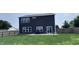 Spacious backyard with a patio, fenced perimeter, and lush green grass, ideal for outdoor entertaining at 1721 N Kaleigh Ln, Greensburg, IN 47240