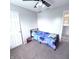 This bedroom features neutral walls, carpeting, a ceiling fan, and an attached closet at 1721 N Kaleigh Ln, Greensburg, IN 47240