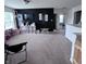 Bright bonus room features black accent wall, neutral carpeting, and great natural light from large windows at 1721 N Kaleigh Ln, Greensburg, IN 47240