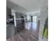 Spacious gray kitchen featuring an island with granite countertops, modern appliances, and a pantry at 1721 N Kaleigh Ln, Greensburg, IN 47240