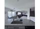 Open-concept kitchen with granite countertops overlooking dining and living areas at 1721 N Kaleigh Ln, Greensburg, IN 47240