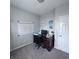 Functional home office with a desk, chair, computer, and a calendar for organization at 1721 N Kaleigh Ln, Greensburg, IN 47240
