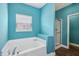 Bright bathroom with a soaking tub, separate shower, and modern fixtures, perfect for relaxing at 1893 Devonshire Ave, Avon, IN 46123
