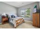 Stylish bedroom with a cozy bed, natural light, and dresser for comfortable living at 1893 Devonshire Ave, Avon, IN 46123
