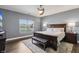 Bedroom featuring neutral tones, a ceiling fan, and a large window overlooking the outdoors at 1893 Devonshire Ave, Avon, IN 46123