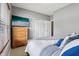 Serene bedroom with natural light, dresser, and calming colors for ultimate relaxation at 1893 Devonshire Ave, Avon, IN 46123