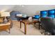 Bonus room setup with large desk, monitor array, and comfortable seating for entertainment and work at 1893 Devonshire Ave, Avon, IN 46123
