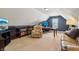 Versatile bonus room featuring plush seating and a home office setup for work and leisure at 1893 Devonshire Ave, Avon, IN 46123