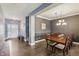 Well-lit dining room with a large wooden table and an elegant chandelier for Gathering gatherings at 1893 Devonshire Ave, Avon, IN 46123