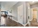 Hallway with hardwood floors provides seamless flow to the living areas and bedrooms at 1893 Devonshire Ave, Avon, IN 46123