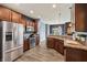 Modern kitchen boasts stainless steel appliances and seamless flow into the dining area at 1893 Devonshire Ave, Avon, IN 46123