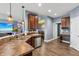 Well-lit kitchen with stainless steel appliances, stylish countertops, and an open view to the dining area at 1893 Devonshire Ave, Avon, IN 46123