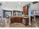 Open-concept kitchen with stainless steel appliances and a clear view into the living room and dining area at 1893 Devonshire Ave, Avon, IN 46123