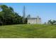 Expansive backyard with lush green grass and mature trees at 19187 Outer Bank Rd, Noblesville, IN 46062