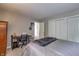 Comfortable bedroom featuring a study desk, closet space, and soft carpet flooring at 19187 Outer Bank Rd, Noblesville, IN 46062