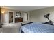 Tranquil bedroom offering a dresser, exercise machine, windows, and neutral colored walls and carpet at 19187 Outer Bank Rd, Noblesville, IN 46062