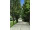 Long driveway lined with mature trees leading to the garage at 19187 Outer Bank Rd, Noblesville, IN 46062