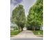 Long driveway framed by mature trees. The property also includes a well-maintained lawn and a shed at 19187 Outer Bank Rd, Noblesville, IN 46062