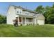 Charming two-story home with a welcoming front porch and manicured lawn at 19187 Outer Bank Rd, Noblesville, IN 46062
