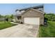 Charming two-story home with a welcoming front porch and attached garage at 19187 Outer Bank Rd, Noblesville, IN 46062