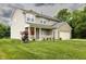 Attractive two-story home with a covered porch, brick accents, two-car garage, and a lush green lawn at 19187 Outer Bank Rd, Noblesville, IN 46062
