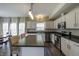 Open concept kitchen featuring modern appliances, an island with bar seating, and lots of natural light at 19187 Outer Bank Rd, Noblesville, IN 46062
