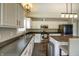 Updated eat-in kitchen featuring sleek appliances, an island with bar seating, and stainless steel appliances at 19187 Outer Bank Rd, Noblesville, IN 46062