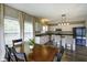 Eat-in kitchen and dining area featuring sleek appliances, an island with bar seating, and lots of light at 19187 Outer Bank Rd, Noblesville, IN 46062